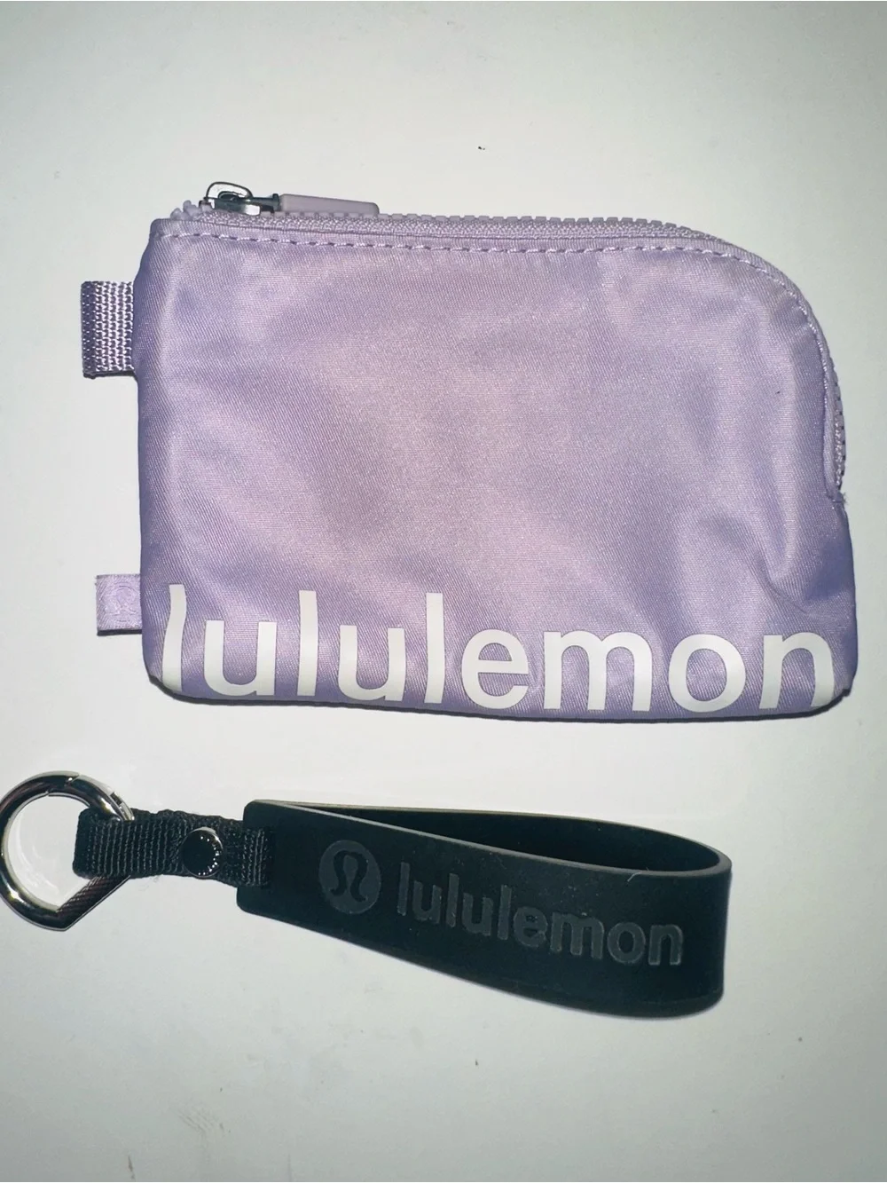 lululemon Lavender Zipper Pouch with Black Silicone Wrist Strap